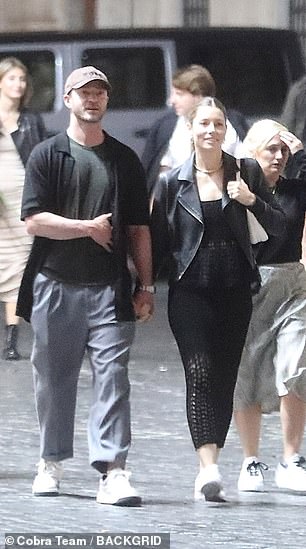 His look: Timberlake was dressed in gray pants and white sneakers, with a dark T-shirt under a black vest