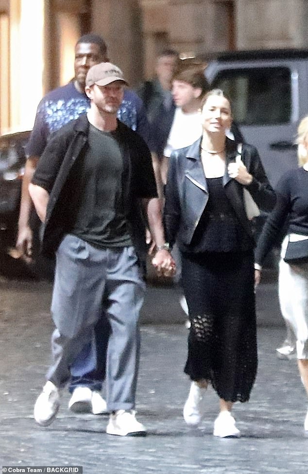 Couple Style: The pop music sensation also wore a baseball cap, complementing his lady, who wore a black outfit