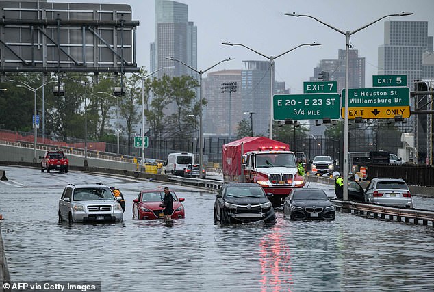 Cars in floodwaters on the FDR Freeway in Manhattan, New York on September 29, 2023