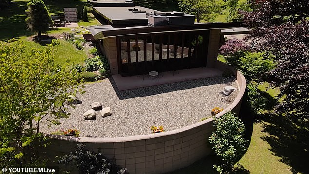 Concrete and mahogany details outside the house have been carefully restored by the most recent owners