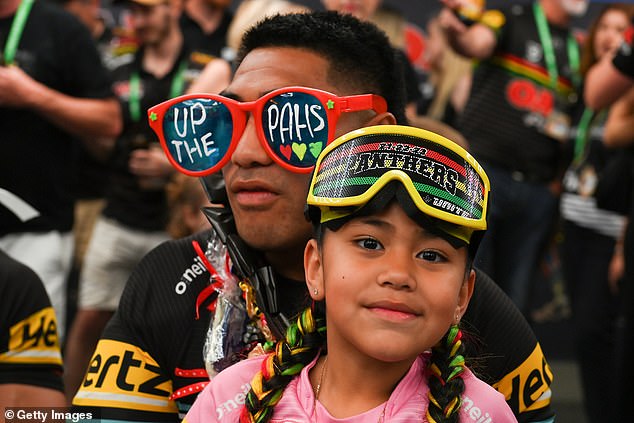 Panthers star Moses Leota celebrates with his daughter after the game