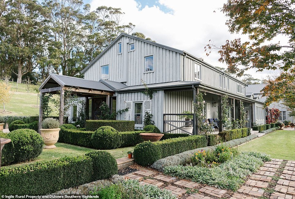 A tree-lined driveway winds past the small farm, yoga barn, dam, lake and orchard, up to the beautiful home that sits atop a grassy hill.