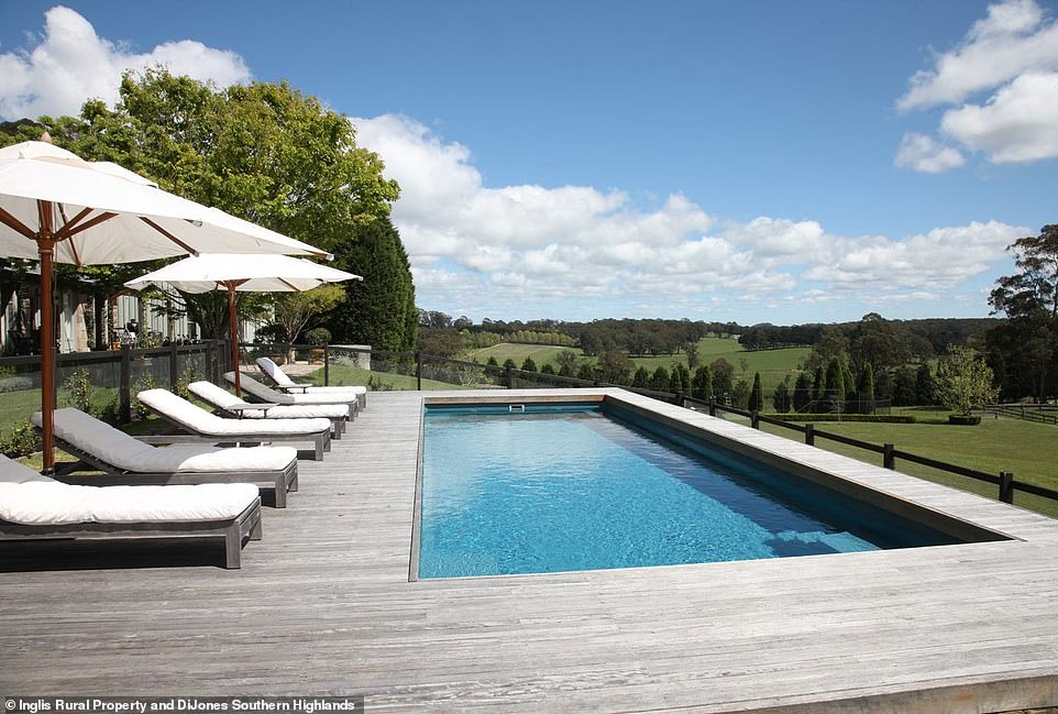 A second living area features an airy kitchen, dining and living area connected to a wooden veranda that opens onto the luxurious swimming pool which overlooks tranquil bush views.