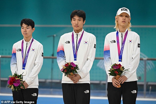 Silver medalists Jung Cheol-won, Choi In-ho and Choi Gwang-ho of South Korea attend the awards ceremony of the men's 3000 meters relay skating event during the 2022 Asian Games in Hangzhou in eastern China's Zhejiang province on October 2 2023