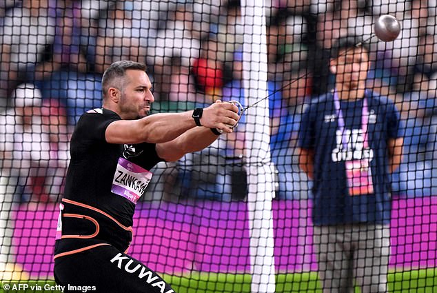 Ali Zankawi of Kuwait is pictured moments before his hammer shattered an official's leg