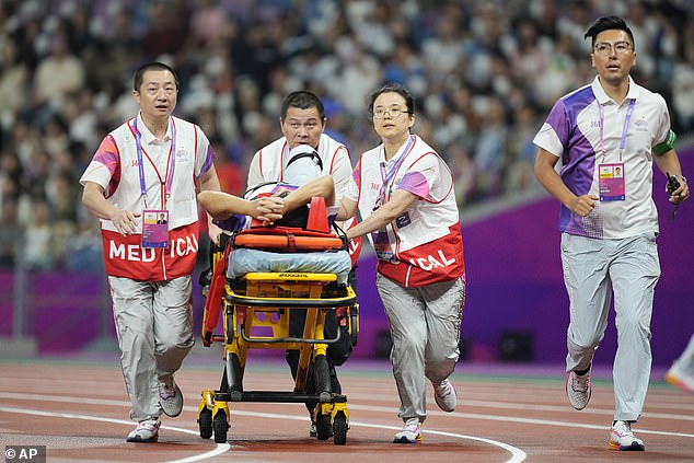 Asian Games official Huang Qinhua was rushed to hospital after receiving a hammer on his leg