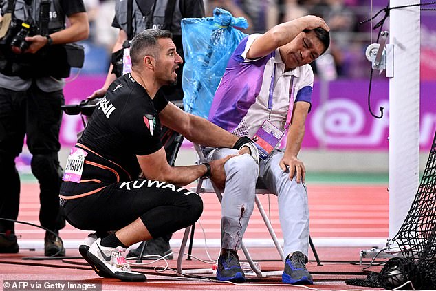 Ali Zankawi (photo, left) rushed over to help the injured official