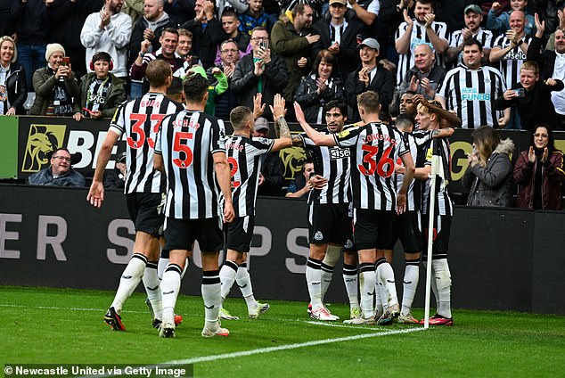 Newcastle United's players celebrate during their 2-0 win over Burnley on Saturday ahead of their meeting with PSG in the Champions League