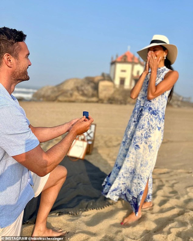 Sweet: The former Pussycat Doll singer, 45, broke the news that the former rugby player, 38, popped the question during a trip to Vila Nova de Gaia in Portugal in June