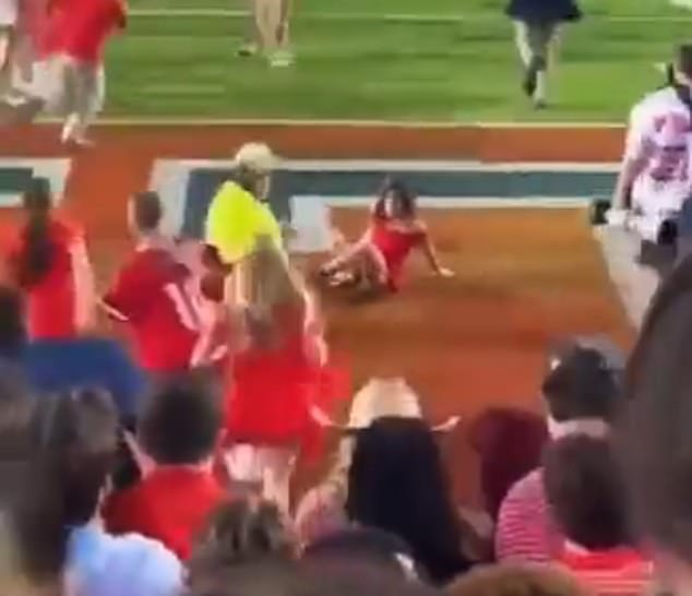 Hundreds of Ole Miss Rebels fans invaded the field after their dramatic 55-49 victory over the LSU Tigers, but one female supporter fell to the ground