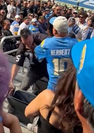 The Raiders fan was punched and pushed