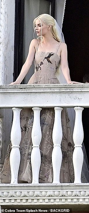 Spectacular: Anya's unconventional dress consisted of a princess shape in a beige shade with embroidery and embellishments and debuted on her balcony shortly after Malcolm was spotted in preparation mode earlier in the day