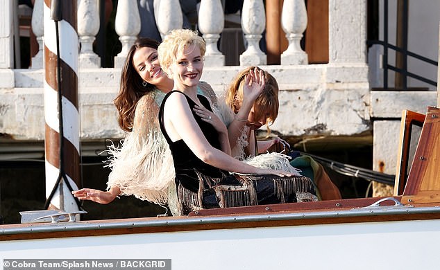 Sweet: Julia appeared in good spirits as she sat on the lavish boat with Keleigh, who also attended the wedding