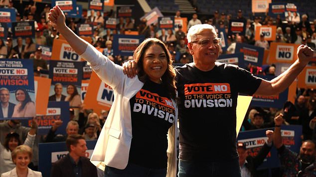 Jacinta Nampijinpa Price and Warren Mundine (right) ended their event with a group photo with their supporters.  Photo: NCA NewsWire/Philip Gostelow.