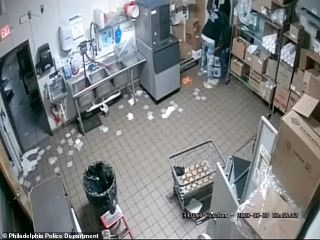 Security camera footage captures the moment one of them comes across the heavy safe in a back office