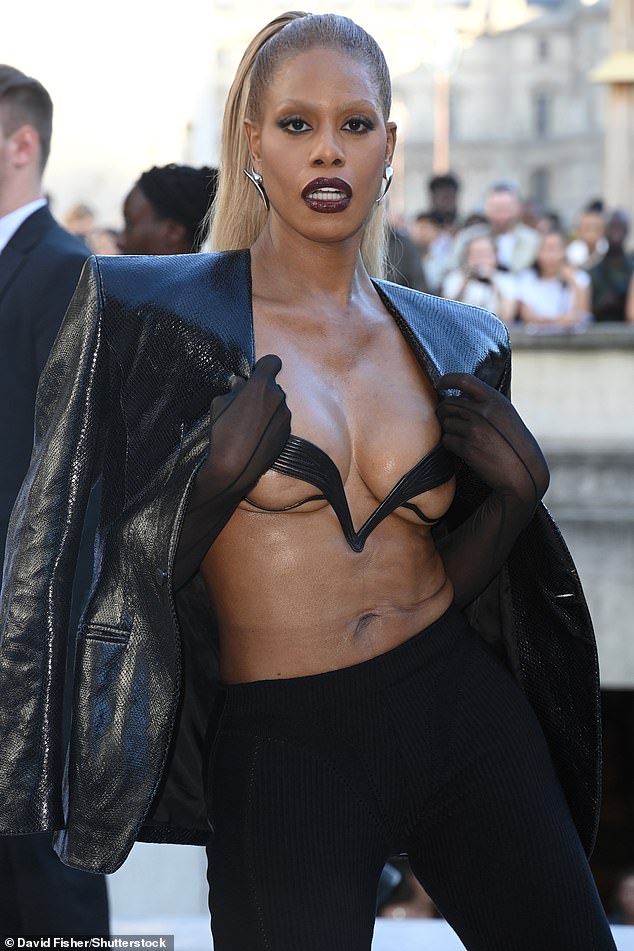 Don't mind me: Laverne opted for a slightly riskier ensemble, barely protecting her modesty by wearing little more than a leather thong over her otherwise exposed breasts