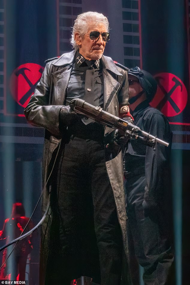 Waters has recently faced criticism for his controversial pro-Russian and allegedly anti-Semitic views.  He is pictured wearing his controversial Nazi-style coat and machine gun during his concert at London's O2 Arena in June this year