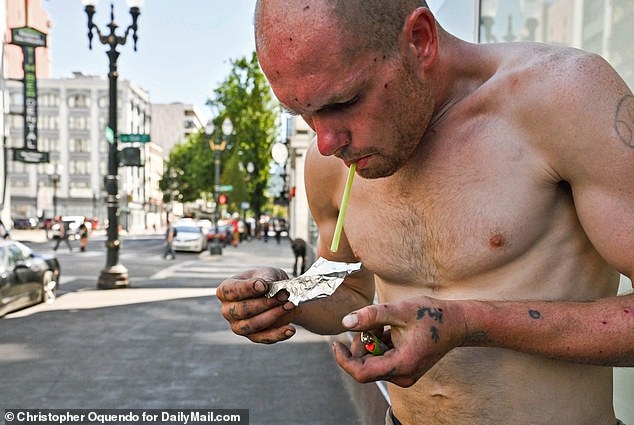 Chris, 28, smokes crack cocaine in broad daylight on the streets of downtown Portland