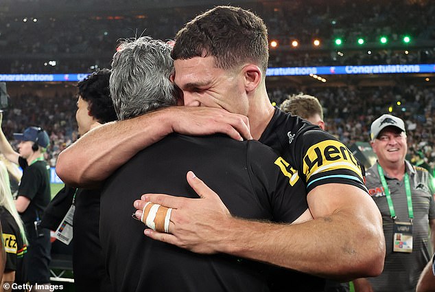 Cleary said he felt like a burden to his son Nathan (pictured together after Sunday's grand final win) who was not playing well at the time