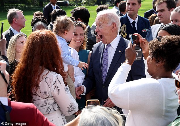 President Biden makes faces with a young guy