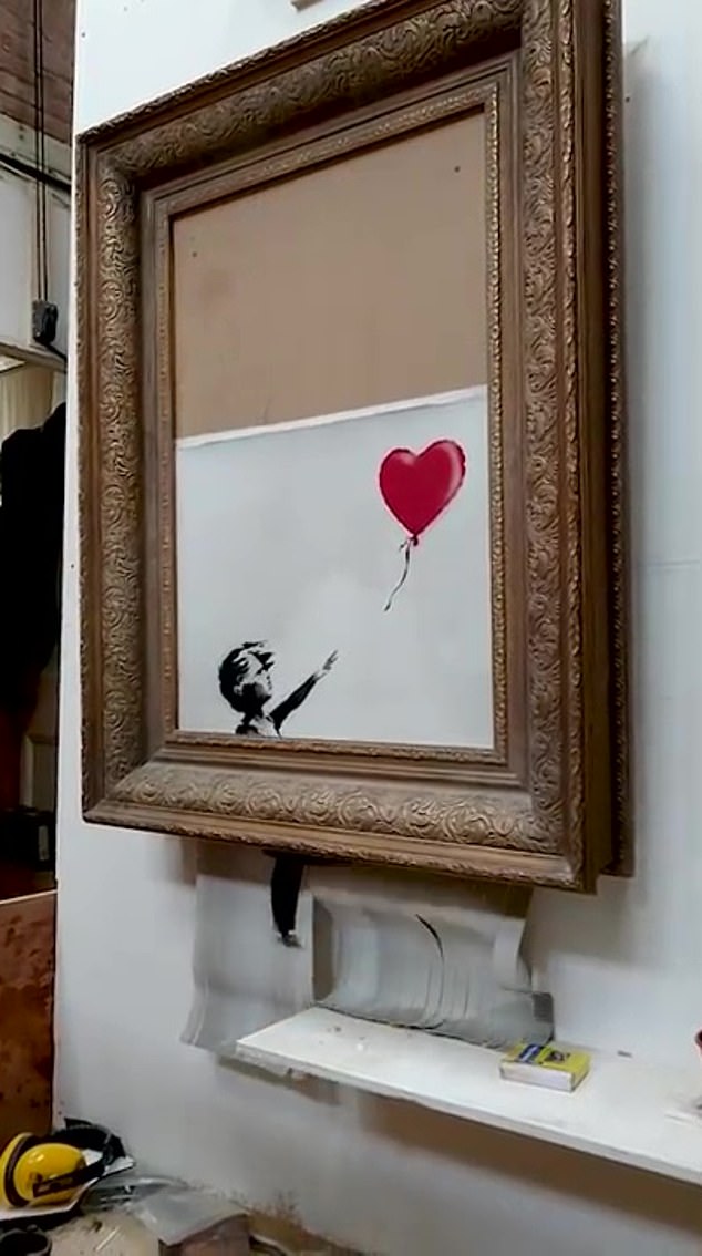 This Banksy artwork, which half tore itself apart, has sold for £18.6 million - four times its estimate