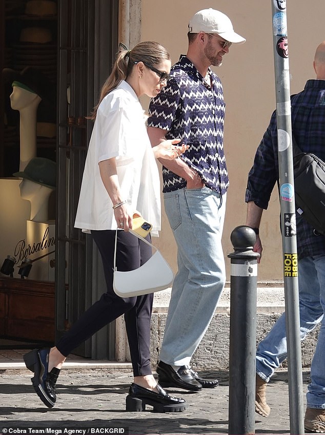 Leggy lady: The Social Network star and his equally famous wife got on an even keel as they leisurely explored more of Rome on Monday