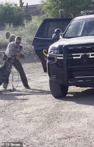 At one point, a deputy can be seen with his hands around the bird's neck