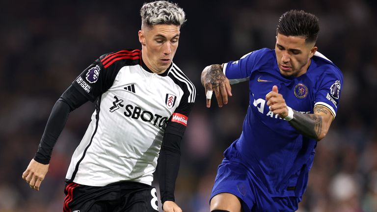 Fulham's Harry Wilson is challenged by Chelsea's Enzo Fernandez 