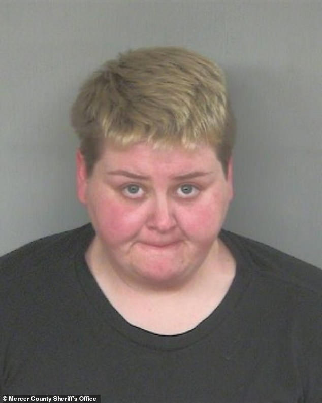 Heather VanWoert (mugshot photo) was charged after her husband, Lucas VanWoert, pleaded guilty to bestiality and animal cruelty