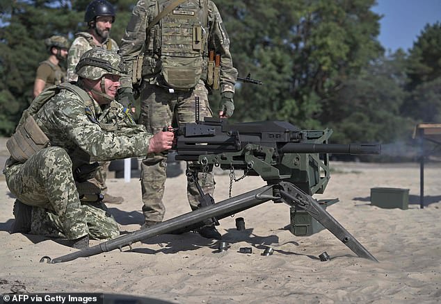 Commander of the Joint Forces, Armed Forces of Ukraine, Lieutenant General Serhiy Nayev fires a US-made MK19 automatic grenade launcher during a military training exercise in Kiev last month