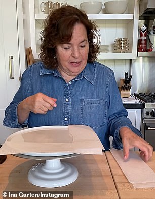 Ina uses baking paper to keep the cake plate clean