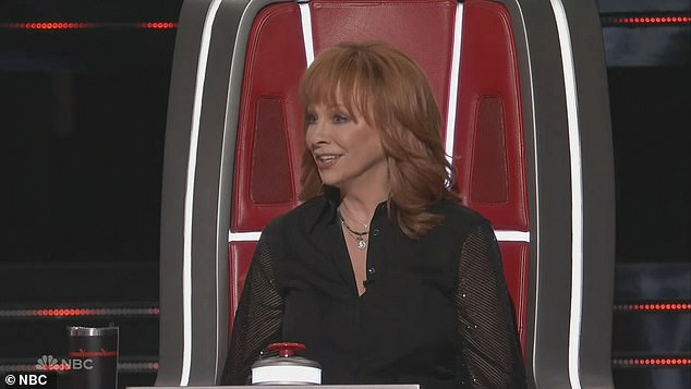 New coach: John and new coach Reba McEntir, 68, both turned their chairs for Talakai