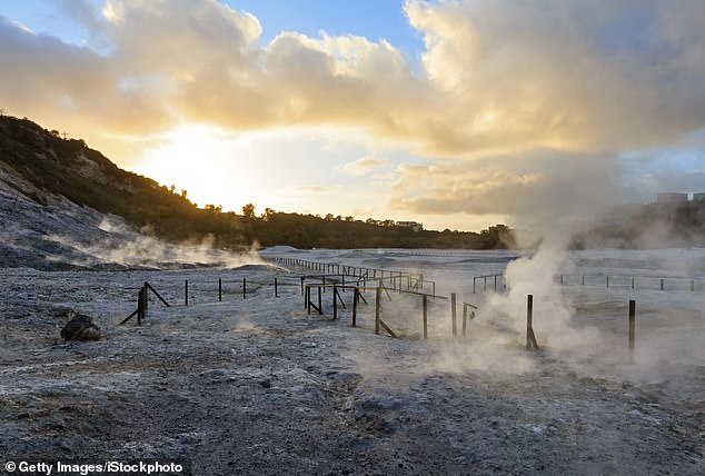 The Solfatara is a shallow volcanic crater with steam and sulphurous fumes