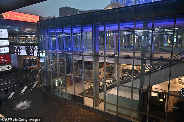 The Siam Paragon shopping center is empty after people were evacuated from the shopping center in Bangkok