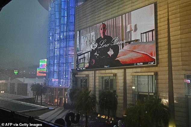 A general view shows the Siam Paragon shopping center in Bangkok today, with the lights off in the shopping center after a shooting incident in the building