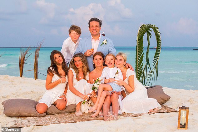 Oliver revealed that his five children (pictured at his and wife Jools' vow renewal this year) have had a 'tough' time growing up in the public eye