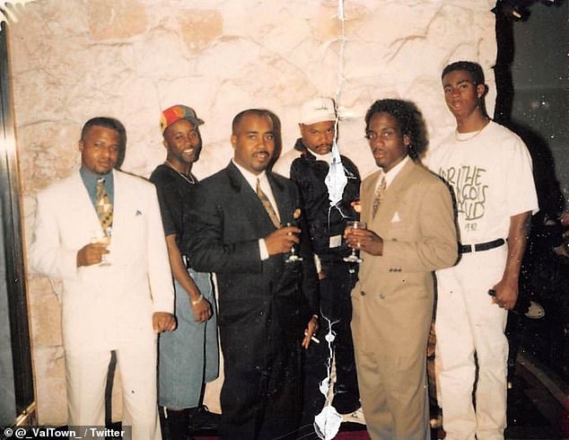 In this image, Davis is seen in the center of a group of five men, with his cousin Orlando Anderson, who was named as a suspect before he was murdered in 1998, on the far right.