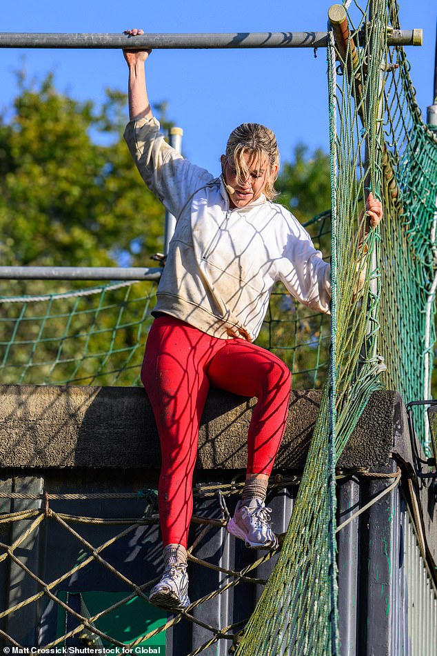 Dedicated: Ashley wore skin-tight red leggings and a matching jacket for her participation in the grueling course