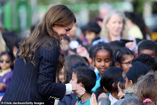 Princess Kate couldn't contain her laughter as she chatted to young royal fans outside the Grange Pavilion