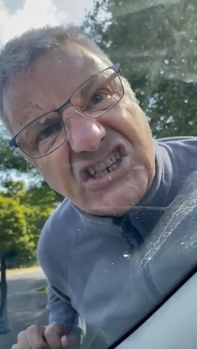 The screaming motorist who punched a terrified female driver's windscreen and called her a 's**g' during a shocking road rage incident has been exposed as foul-mouthed Peter Abbott, 59