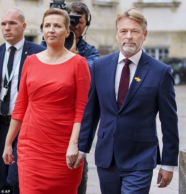 Denmark's Prime Minister Mette Frederiksen (left) and her husband, Bo Tengberg (right) were also present