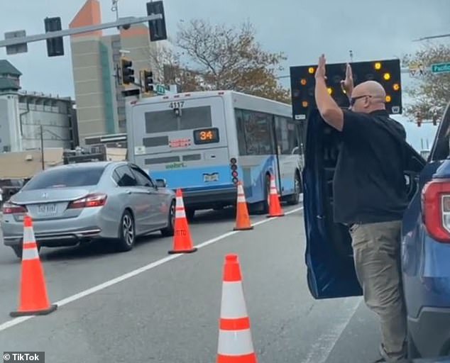 The motorcyclist appeared to pull his own gun from the bike seat in response, but police quickly arrived and the pair retreated.