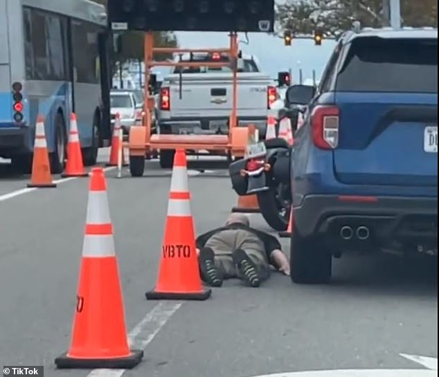 Police told the two men to put their weapons away and lie on the ground as more police cars arrived at the dramatic scene