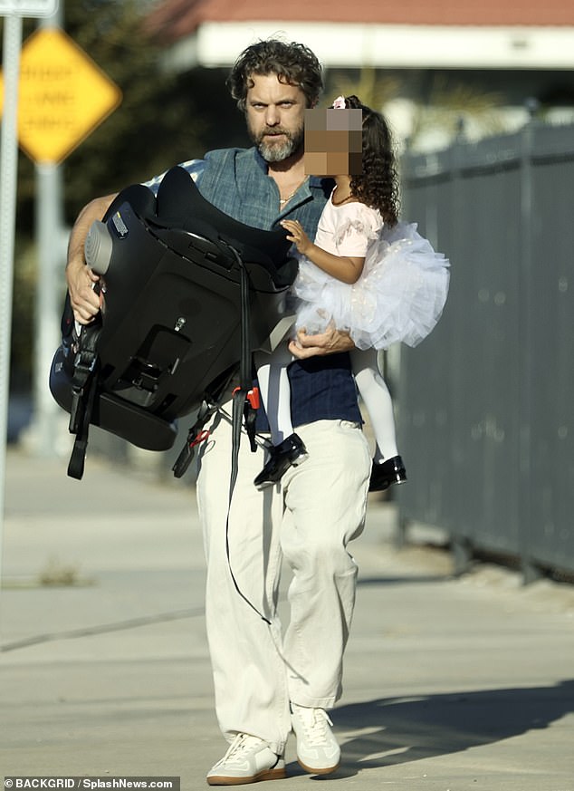 Juno: The actor wore a blue patterned shirt, white pants and sneakers as he chatted with his daughter