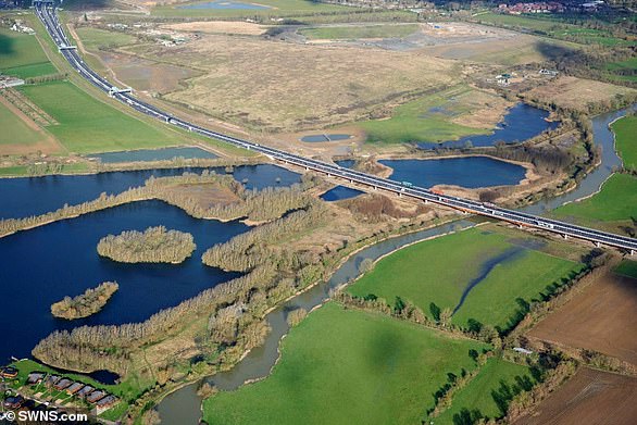 The new stretch of road (pictured) opened in May last year, but the millstone wasn't the only archaeological find revealed before work was completed.  Other finds included the tusk of a woolly mammoth, the skull of a woolly rhino, an abandoned medieval village and three dismembered men from 1,500 years ago.  Archaeologists also found the earliest known evidence of beer brewing in Britain, dating back to as early as 400 BC.