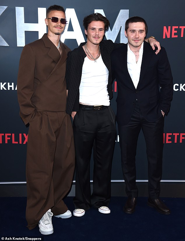 They look familiar: As they posed for photos at the star-studded event, sons Brooklyn, Romeo and Cruz each bore a striking resemblance to their father at different points in his football life