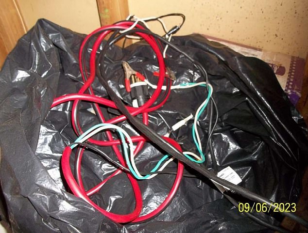 Authorities found a device consisting of jumper cables attached to a plug and covered in blood and dog hair.  They said the device is used to kill dogs after they lose a fight