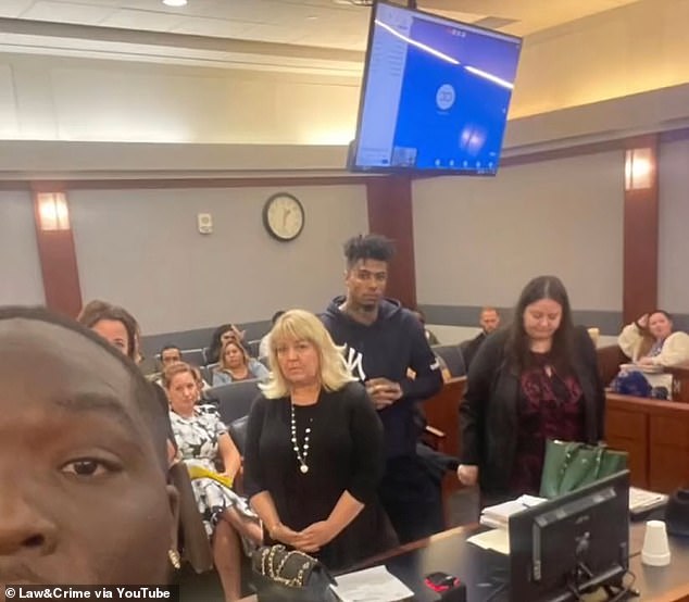 Traylor took a photo with half his face hidden, making sure Porter and his lawyers were in the picture