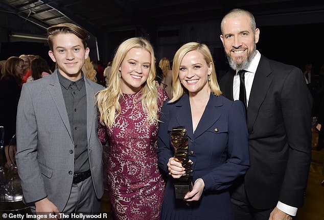 The former couple pictured with Reese's oldest children, Deacon and Ava, in December 2019