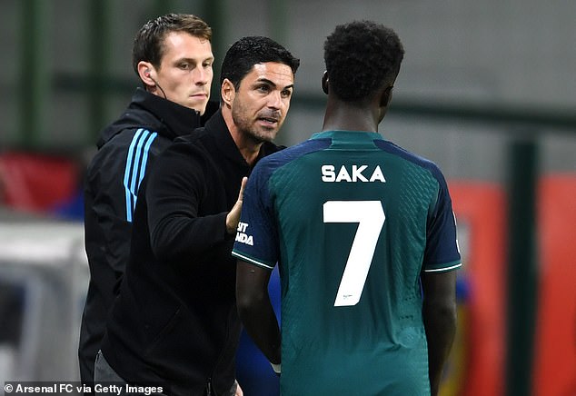 Mikel Arteta (left) hopes his injury is not serious, with Saka crucial for the Gunners this season